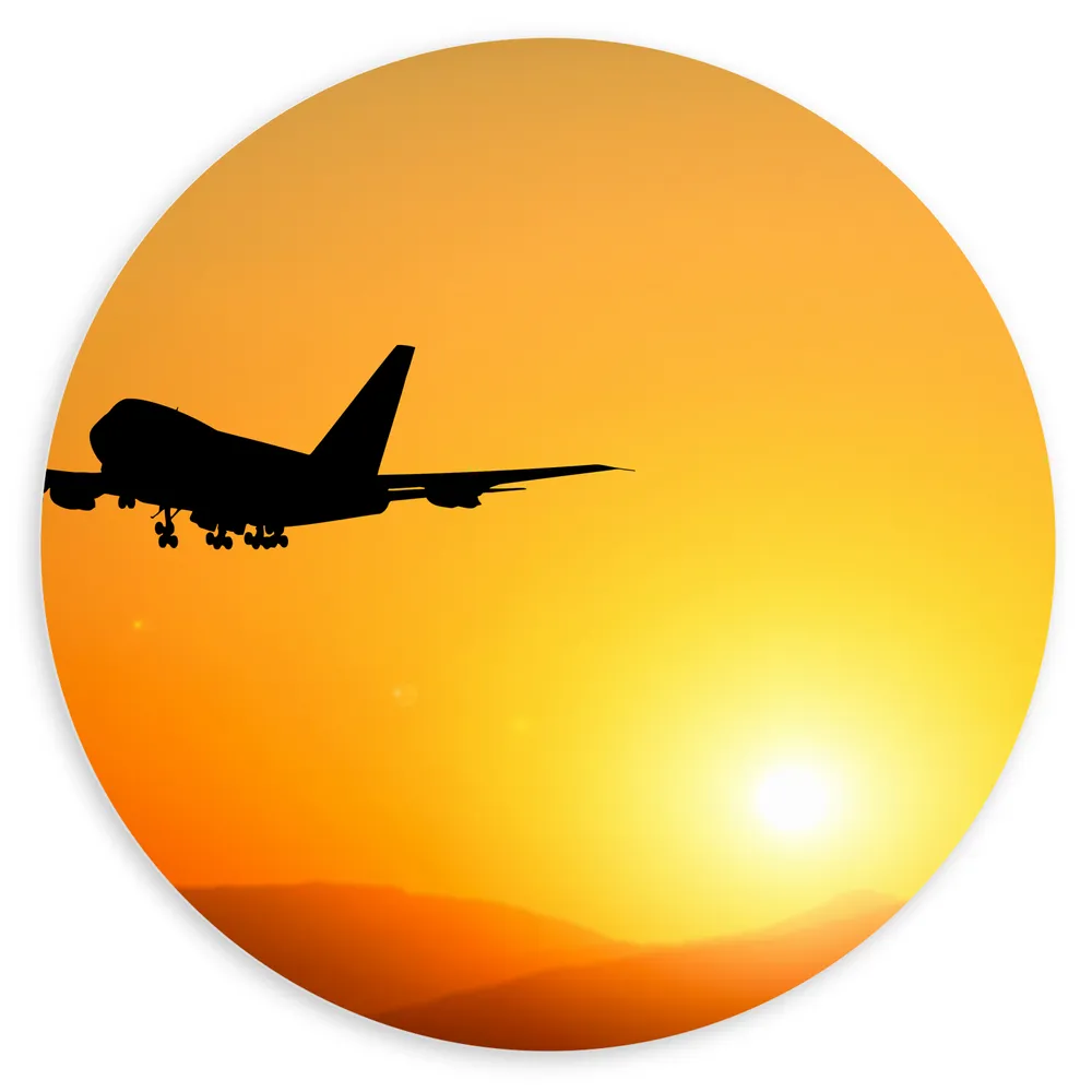 Dibond Muurcirkel - Silhouet van Passagiers Vliegtuig Wegvliegend van Zonsondergang