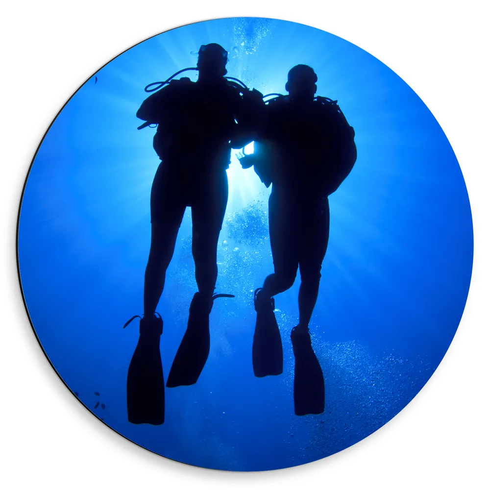 Dibond Muurcirkel - Silhouet van Duikers in de Zee